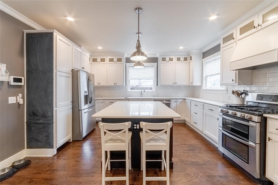 No shortage of storage or counter-space in this farmhouse kitchen!