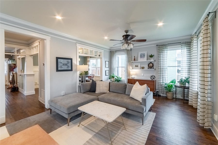 Decorative electric fireplace flanked by built-ins.