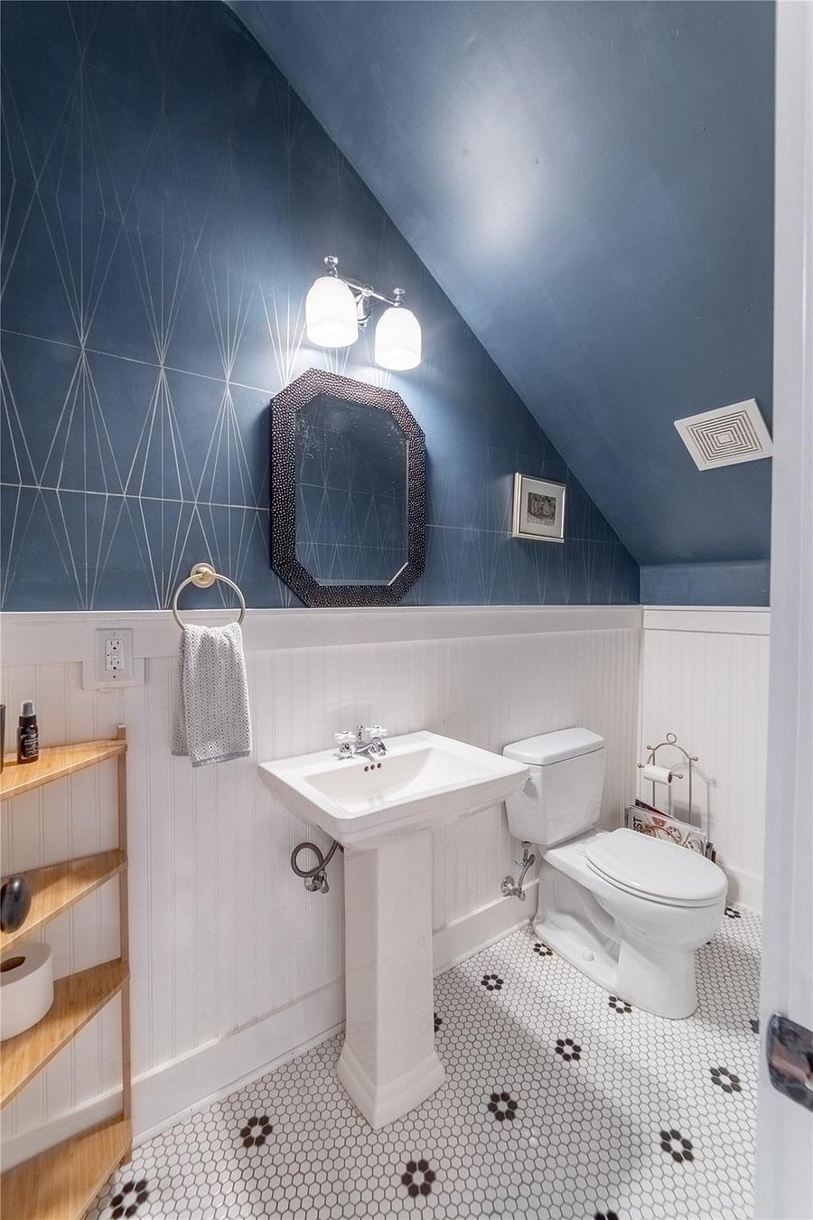 Stylish half bath downstairs.