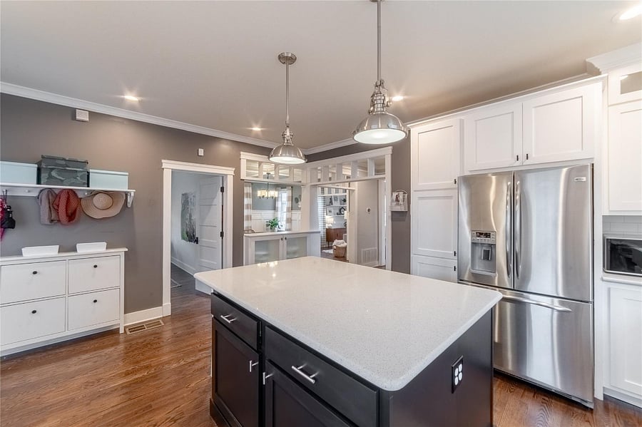 Spacious kitchen island with a place to hand keys, coats and shoes.