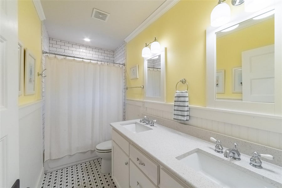 Full bath with dual sinks upstairs.