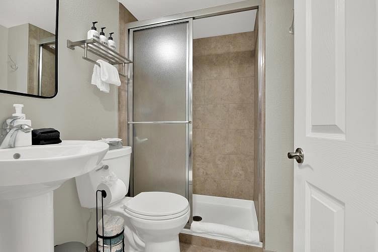The lower level bathroom is adjacent to the bedroom. It is small in size, but big enough to get the job done, and comes with all the starter amenities found in the other two.