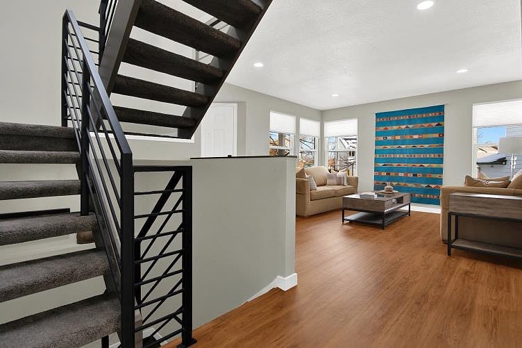 Stairway to second floor and lower level.