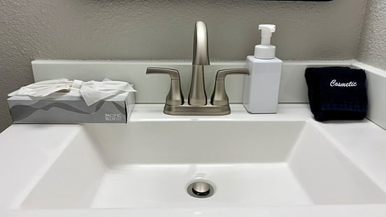 The vanity in the main floor bath has a unique and handy "U" shaped drawer under the sink for your personal items. It too comes with starter soap, tissues and black face wash rags.