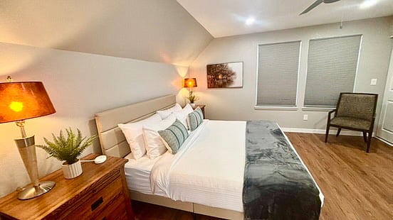 Each side of the King sized bed has an oversized night stand, with cedar drawers and a pullout to extend the cabinet top to hold all your treasures and necessities. Each side also has a great lamp and a personal charger.
