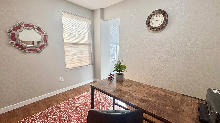 Just behind the Chill Space is our house office or work space. The blind on the top window drops down to show a great view of the Hog Back, a ridge that is our gateway to the Rockies.