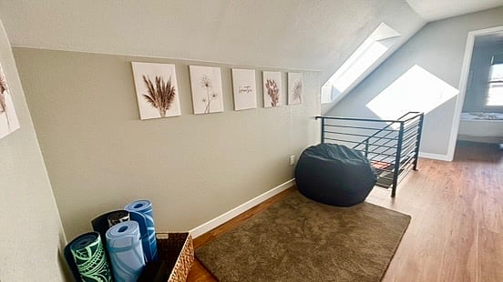 This great space was specifically designed for relaxation. Whether you enjoy yoga, pilates, QiGong, Tai Chi, meditation, or any other practices, this space is easy and comfortable, complete with yoga mats, a yoga brick, stretch bands, and other items to get you going!l