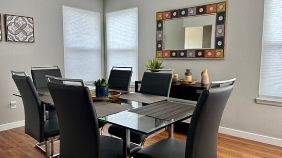The dining room is adjacent to the kitchen, and makes for a wonderful place to dine, write cards, entertain, or simply relax.