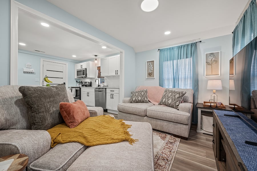 Cozy living room space next to private, rear entrance