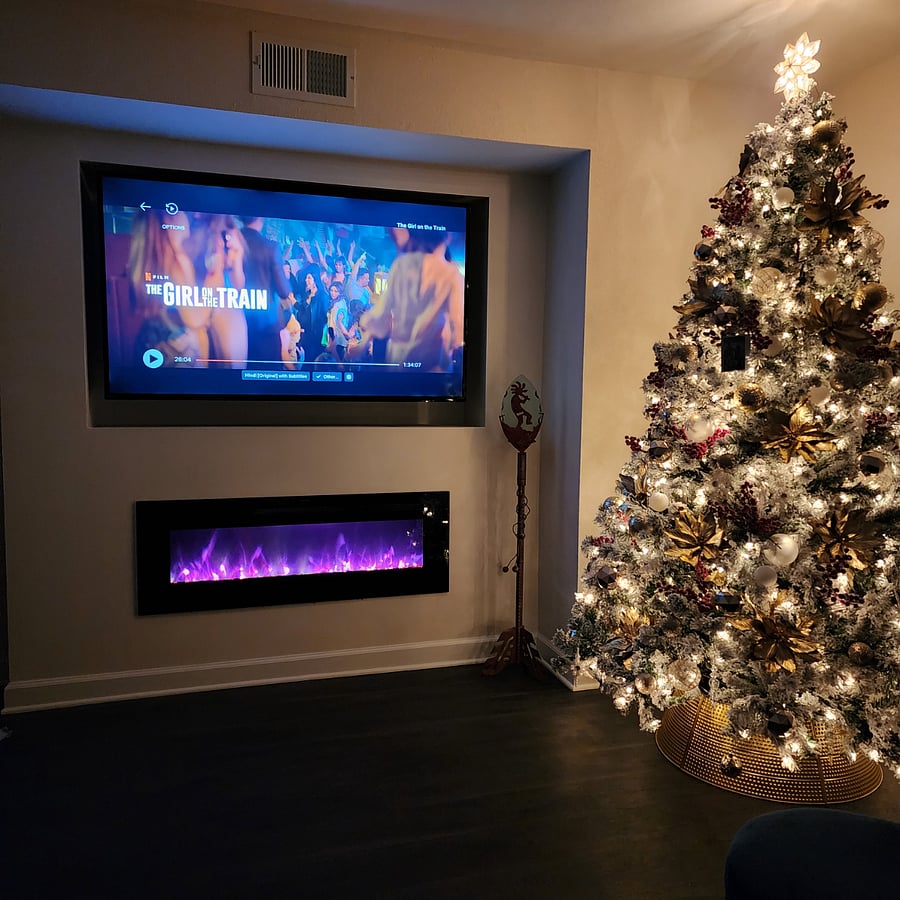 Wall-mounted electric fireplace.