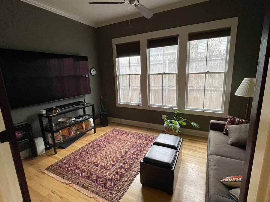 TV room has light-blocking window shades and Sonos Surround Sound.