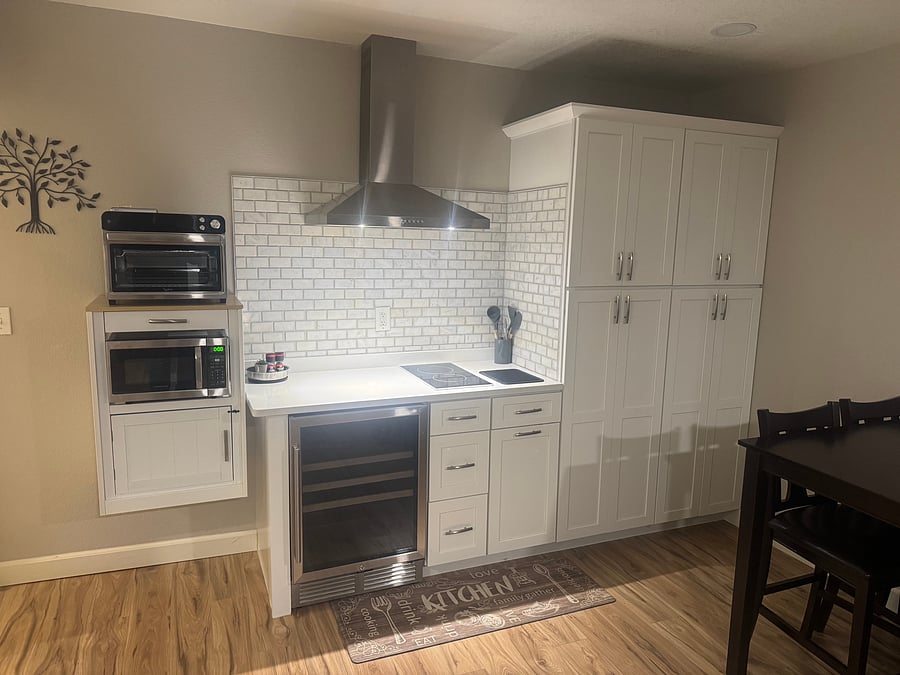 Fantastic Countertop Oven/Air Fryer, Microwave, Mini Frig, 2 Burner Cook Top, Exhaust Fan with light and Cabinets with great storage space.