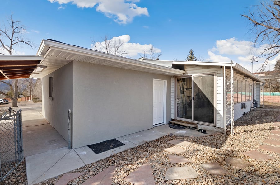 You rear entry slider or walk down the path to the keypad door to also enter sunroom gym and the stairs to your apartment.
