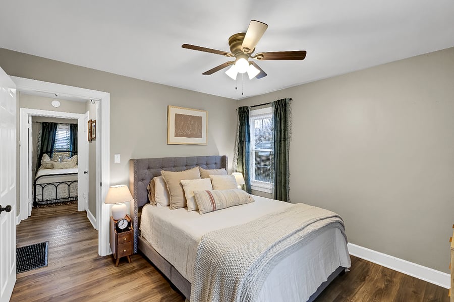 2nd bedroom with queen sized bed and light blocking curtains.