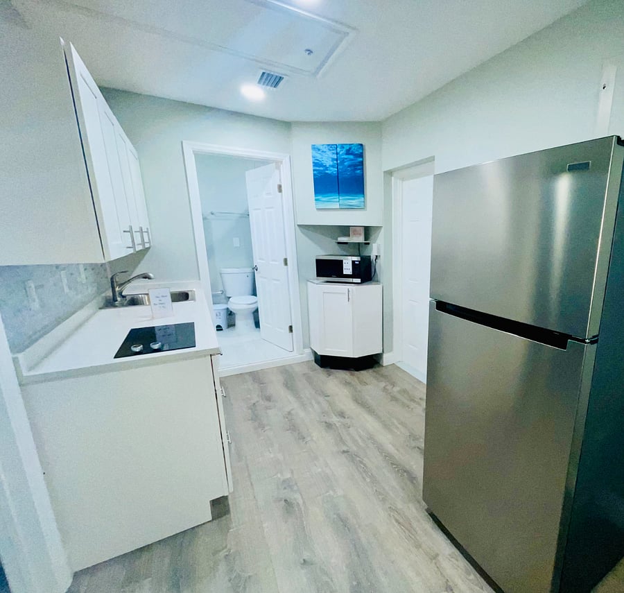 Open kitchen space, regular-sized refrigerator with plenty of space. 
