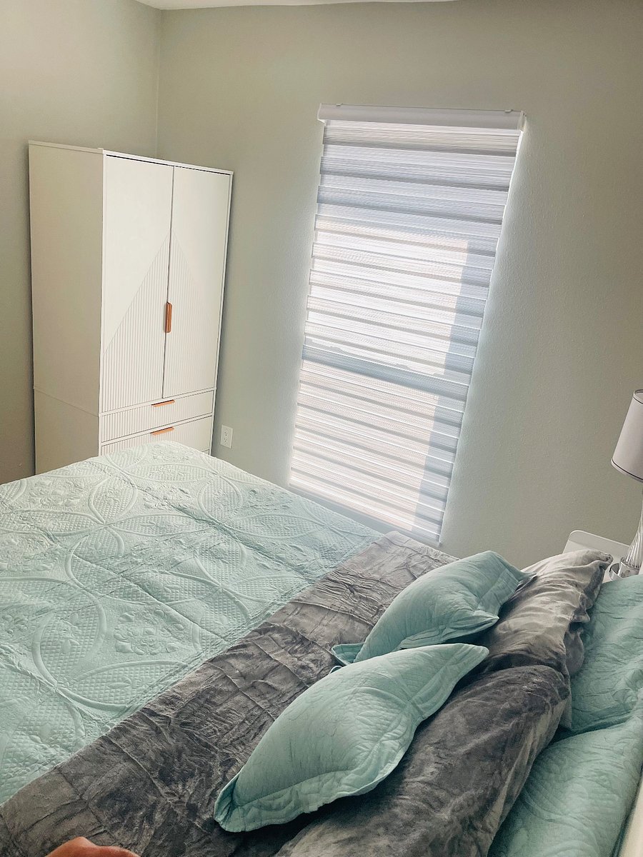 Room 1: with a Queen bed, comfortable mattress, Wardrobe closet with 2 doors, clothes rail, and 3 large drawers.