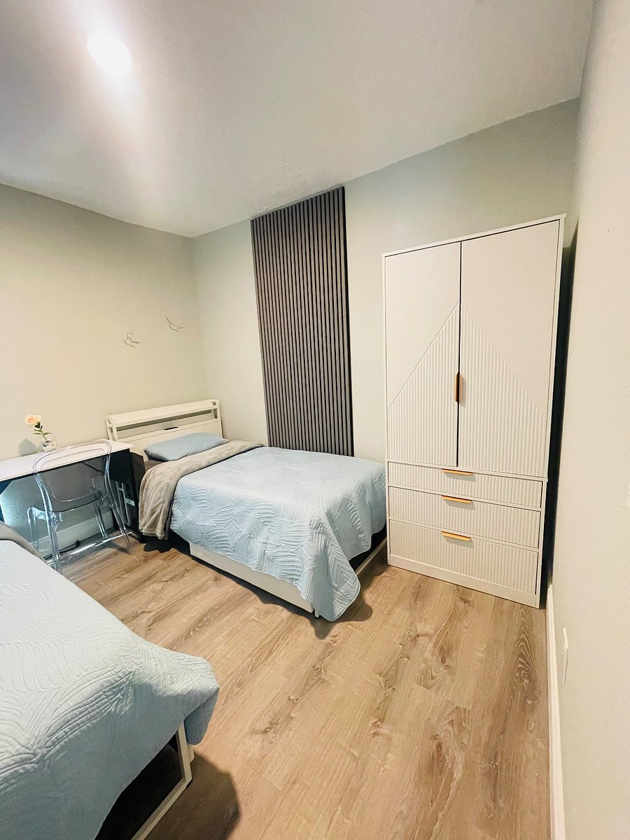Room 2: two twins bed, with comfortable mattress, extra storage under the bed, and a wardrobe closet with 2 doors, a clothes rail, and 2 drawers. 