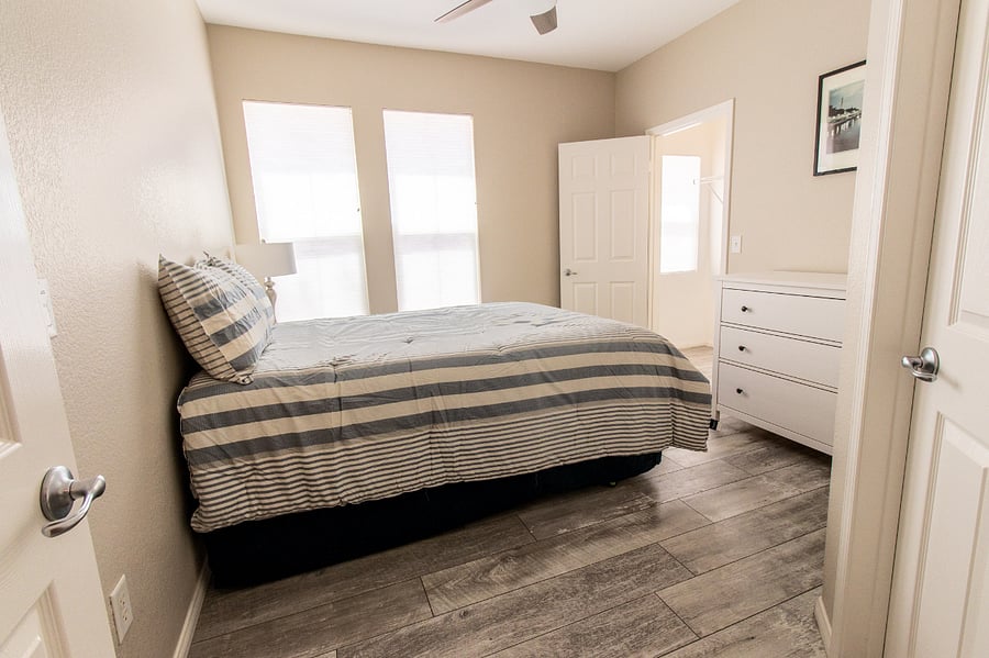Second Bedroom has a Queen Bed, Dresser and Nightstand with a large Walk In Closet and attached Bathroom