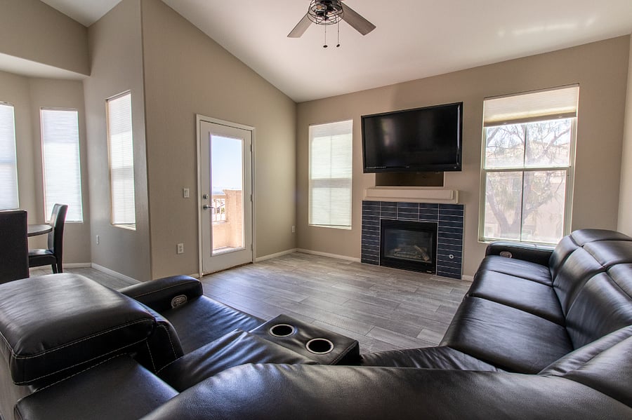 Great Room includes Leather Reclining Sectional, Large TV and Balcony to enjoy the views