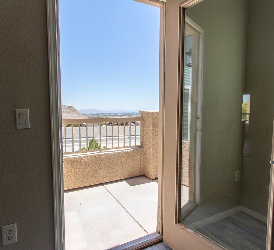 Balcony off Great Room leads to incredible Views of the City and Mountains