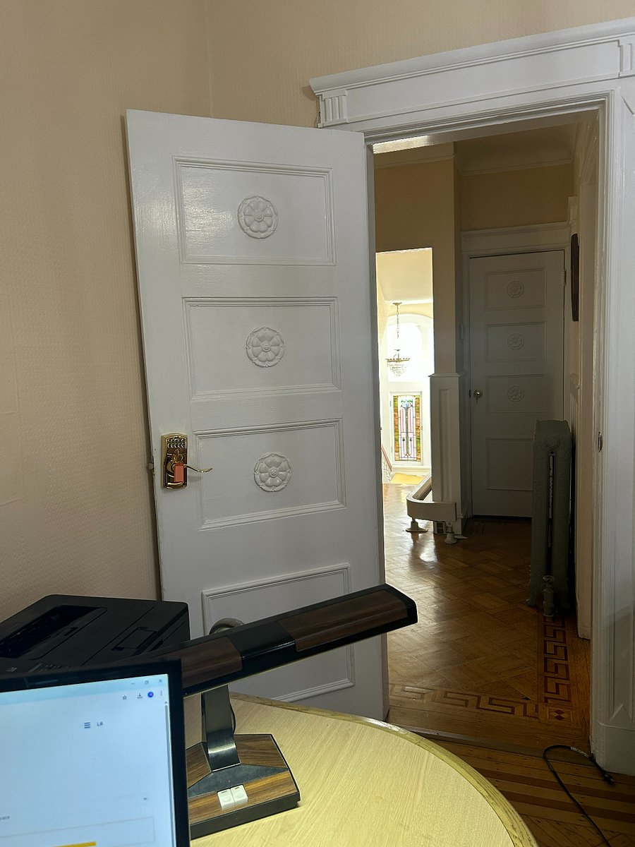 Photo depicts view on exiting tv room/office emptying into second floor hallway. Note: Chair lift railing end station point (second floor level) at top of stairs.
fast internet
