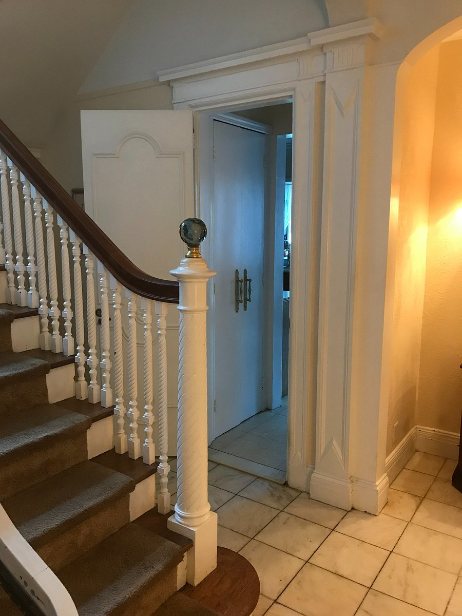 Entry to the kitchen just off the main hall, 1st floor. Kitchen pantry door visible at entrance to kitchen..