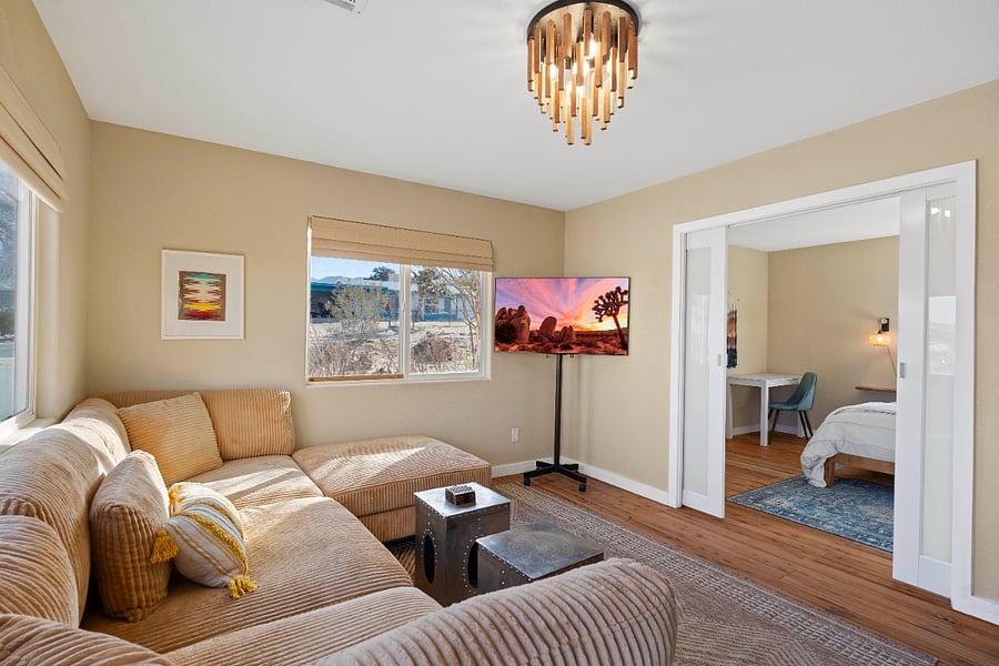 Spacious soft seating and 55 inch TV that can be moved.