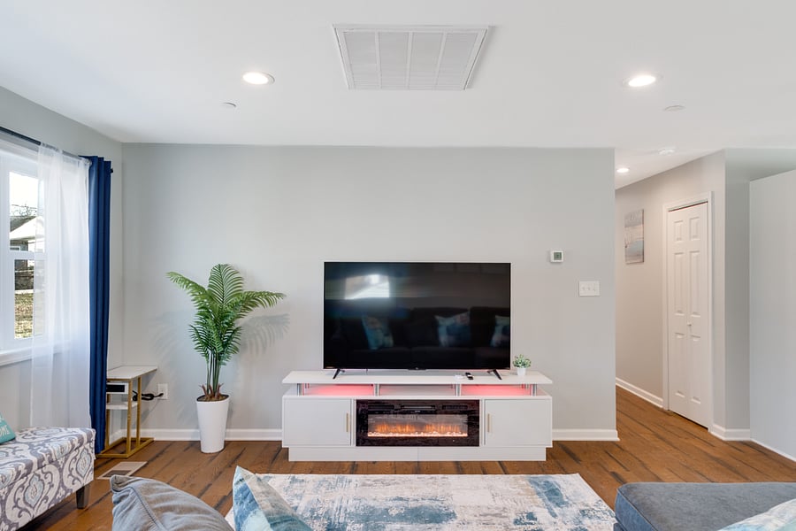 Unwind with your loved ones in front of the cozy fireplace, where warmth and comfort create the perfect setting for relaxing moments and cherished memories.