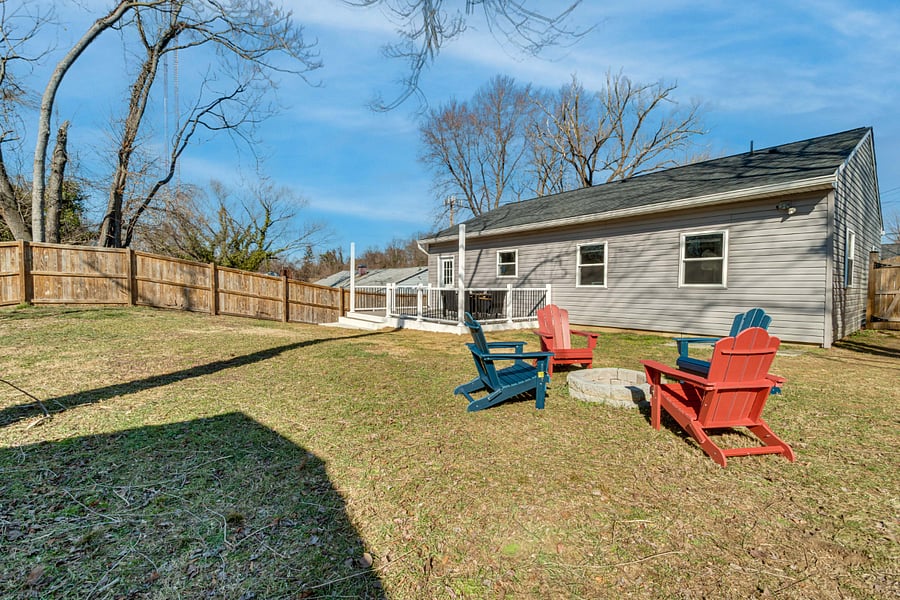 Relax by the firepit as the kids play safely in the spacious fenced yard, while you savor a peaceful moment on the patio, enjoying the warmth and tranquility of the outdoors.
