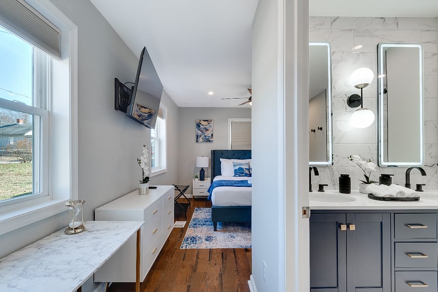 Enjoy the serene ensuite bath, ample storage space, and a private workspace, creating a perfect balance of relaxation and convenience for your stay.