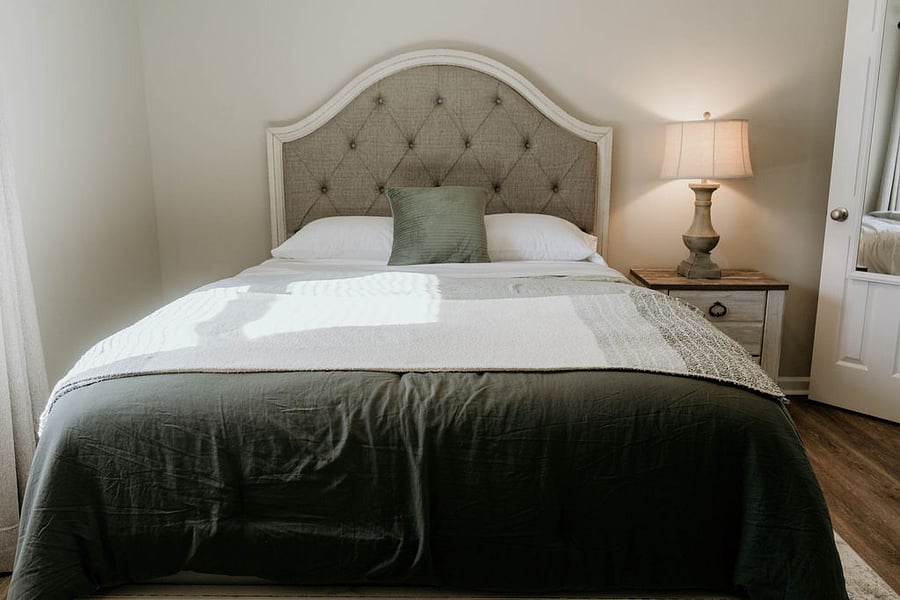 Drift into restful sleep on a brand-new Sealy mattress, complete with blackout curtains and a sound machine for ultimate relaxation.