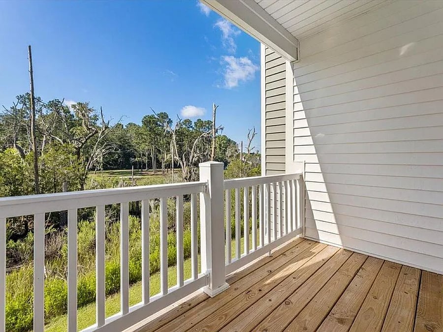 The outdoor deck offers breathtaking views of the serene marshlands. Whether you're sipping morning coffee as the sun rises or unwinding with a sunset cocktail, this peaceful view provides the perfect backdrop for enjoying the sights and sounds of the Lowcountry.