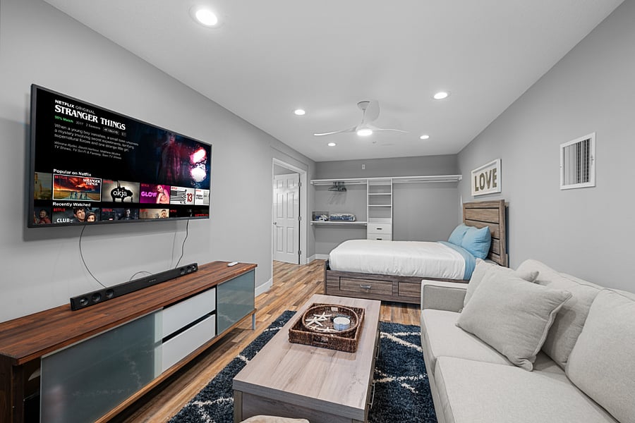 3rd bedroom with queen bed and relaxation lounge
