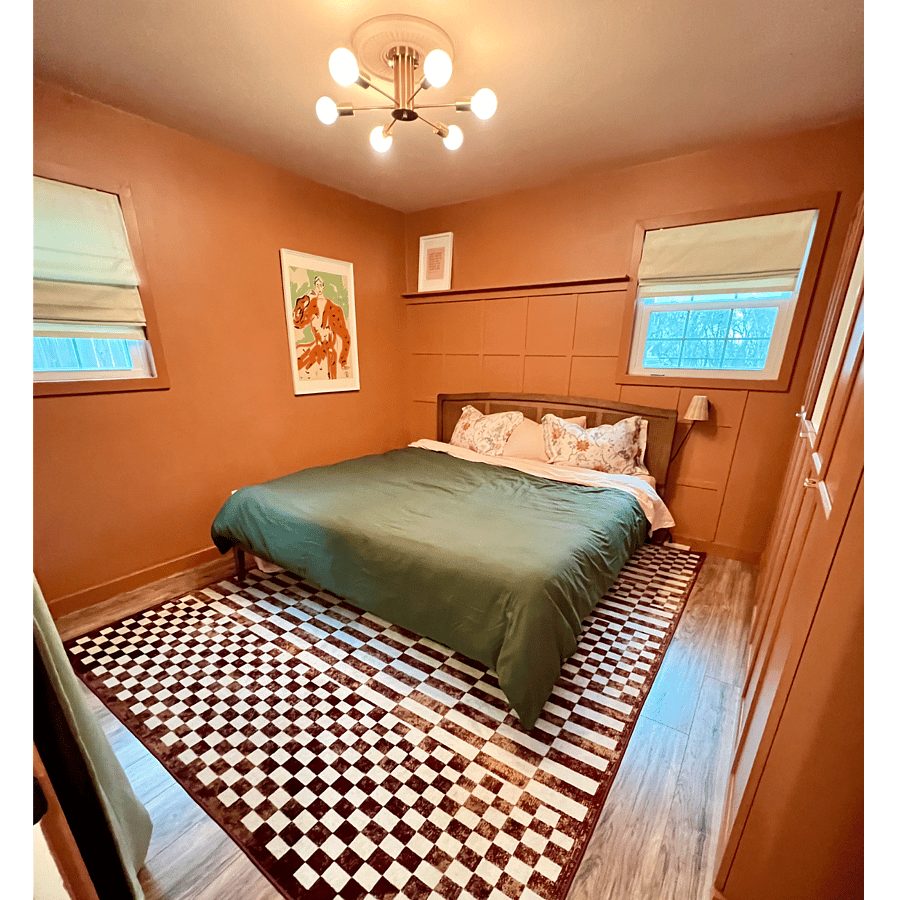 Master bedroom with king bed and built in wardrobe cabinets