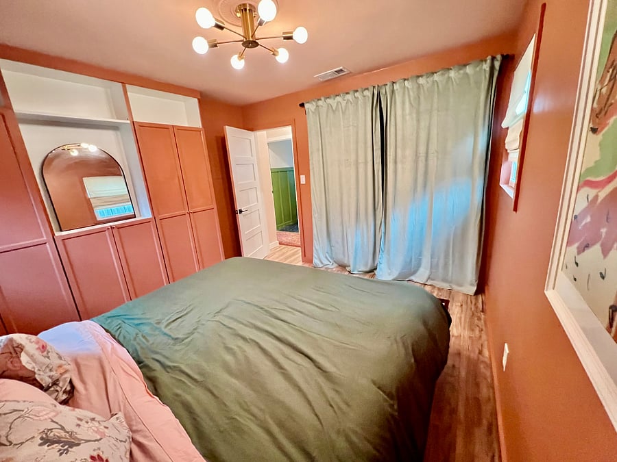 Master bedroom with detail on wardrobe and curtained closet