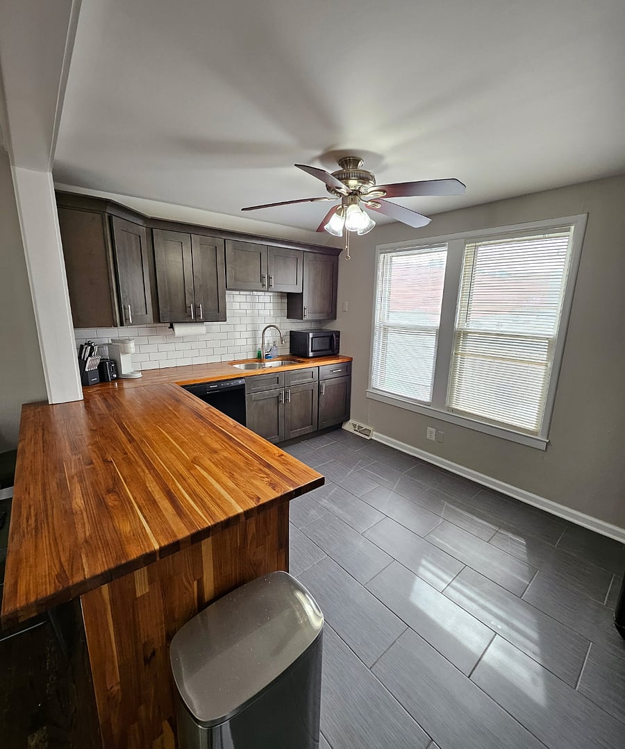 Bright & Spacious: A cheerful kitchen with plenty of counter space and natural light.