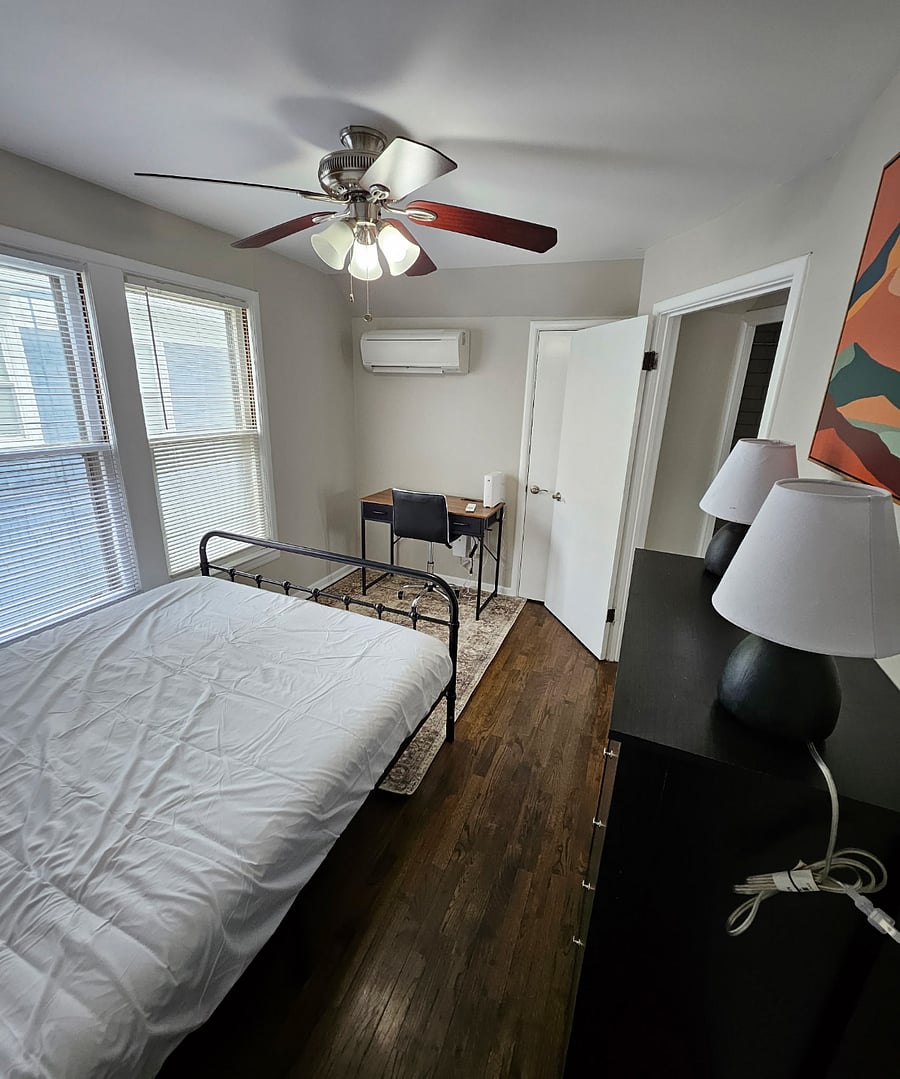 Sleep, Store, and Study: This cozy bedroom features two closets, a handy desk, and extra storage to keep things organized.