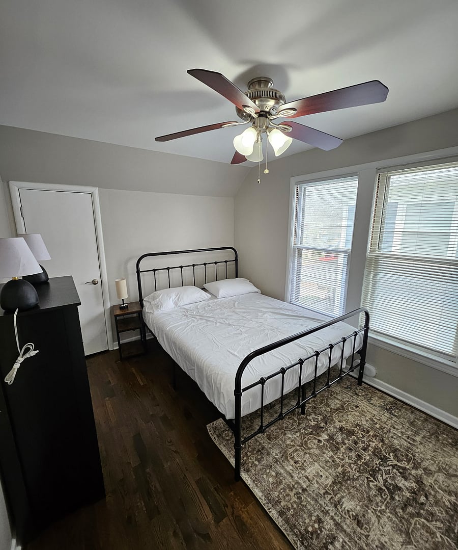 Your Personal Retreat: Designed for comfort and convenience with a rug underfoot, workspace, and generous storage options.