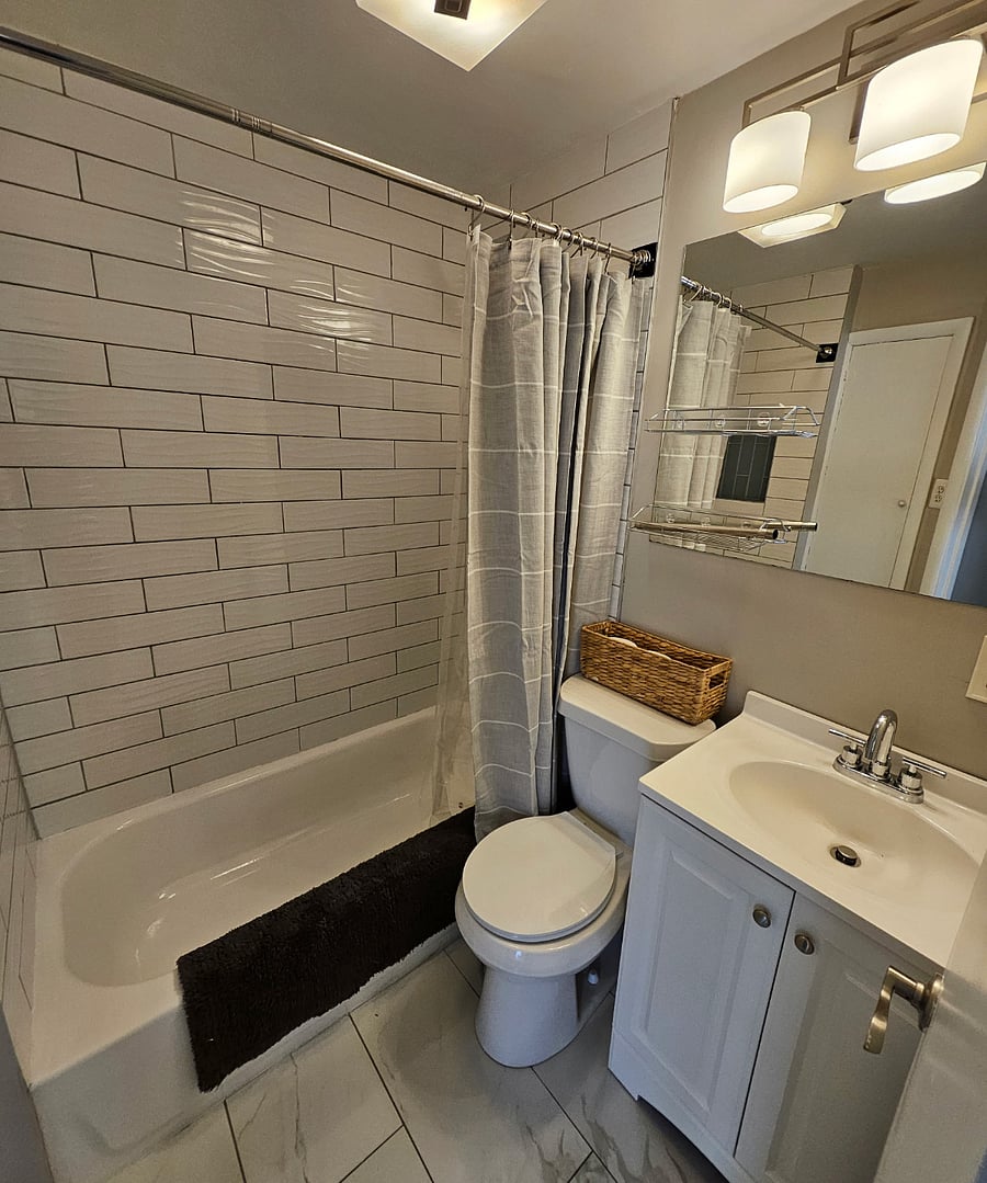 Clean & Classic: Timeless subway tile meets smart built-in storage for a bathroom thats both beautiful and functional.