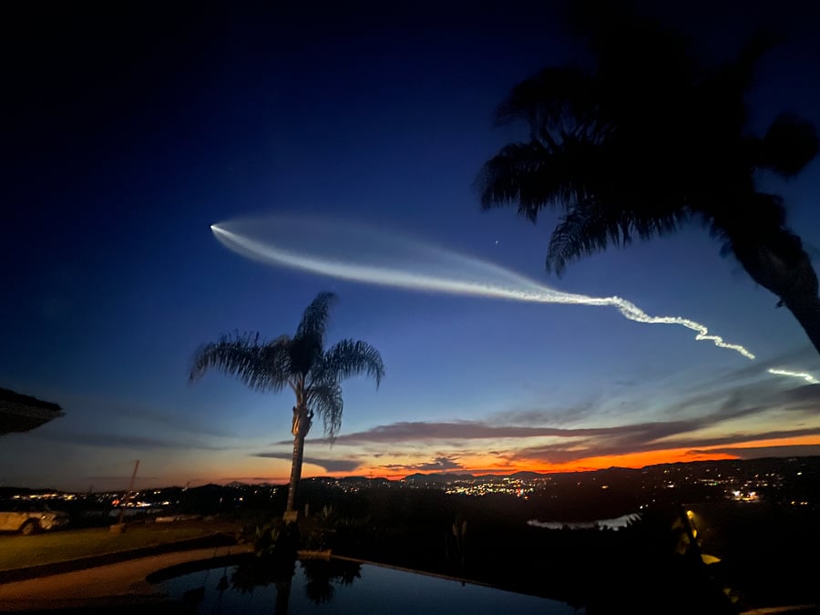 Poolside at dusk watching a Space X launch