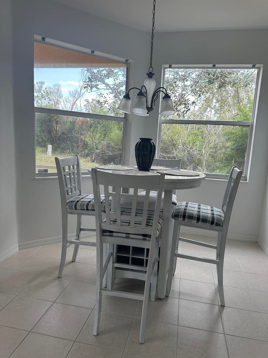 Dining area with view of beautiful backyard.
