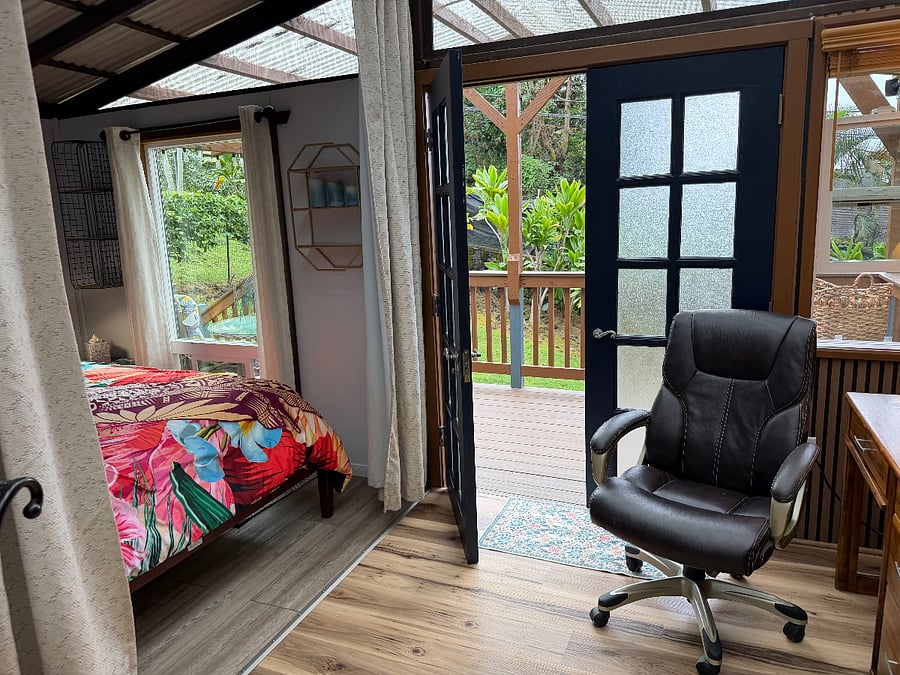 French doors for air flow. Lead to your covered Trex deck with BBQ and table and chairs for outdoor dining. Stairs lead down to your fenced yard!