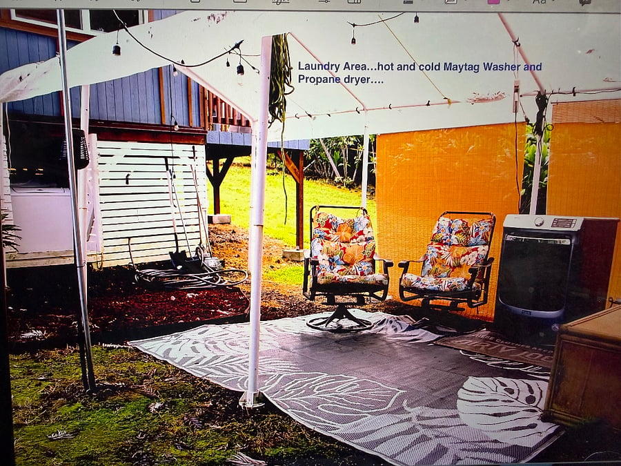 Outdoor convered laundry area. Gas dryer. Hot water washer.
