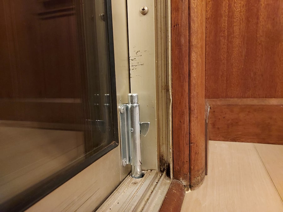 Foot lock present to secure the 8 foot slider between the dining area and the sunroom