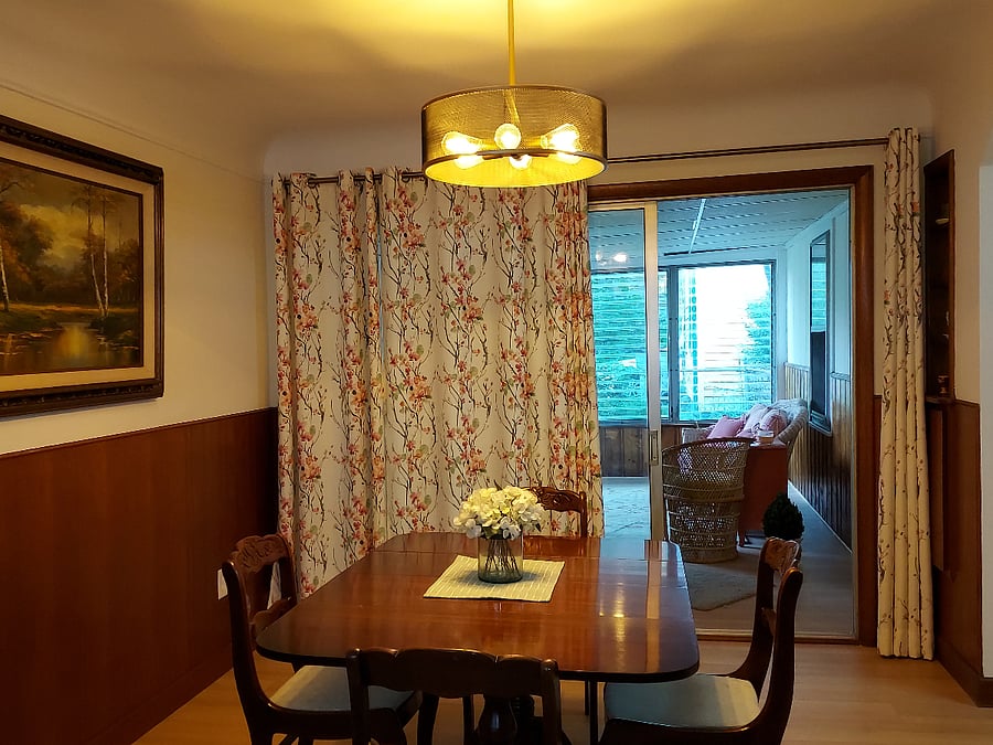 Dining area adjoins the rear sunroom.