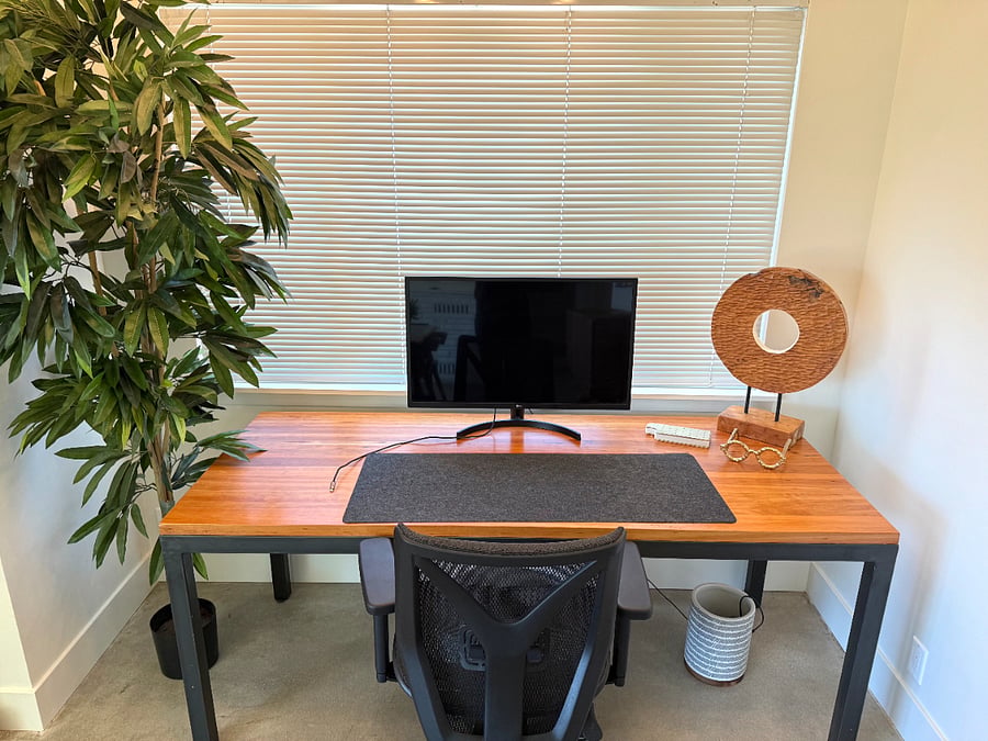 Workspace with desk, office chair, and external monitor (located in front living/dining room)