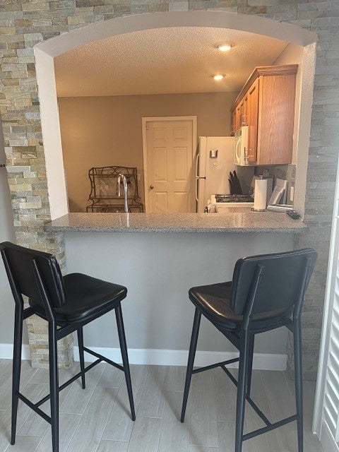 view from living room towards kitchen with breakfast bar