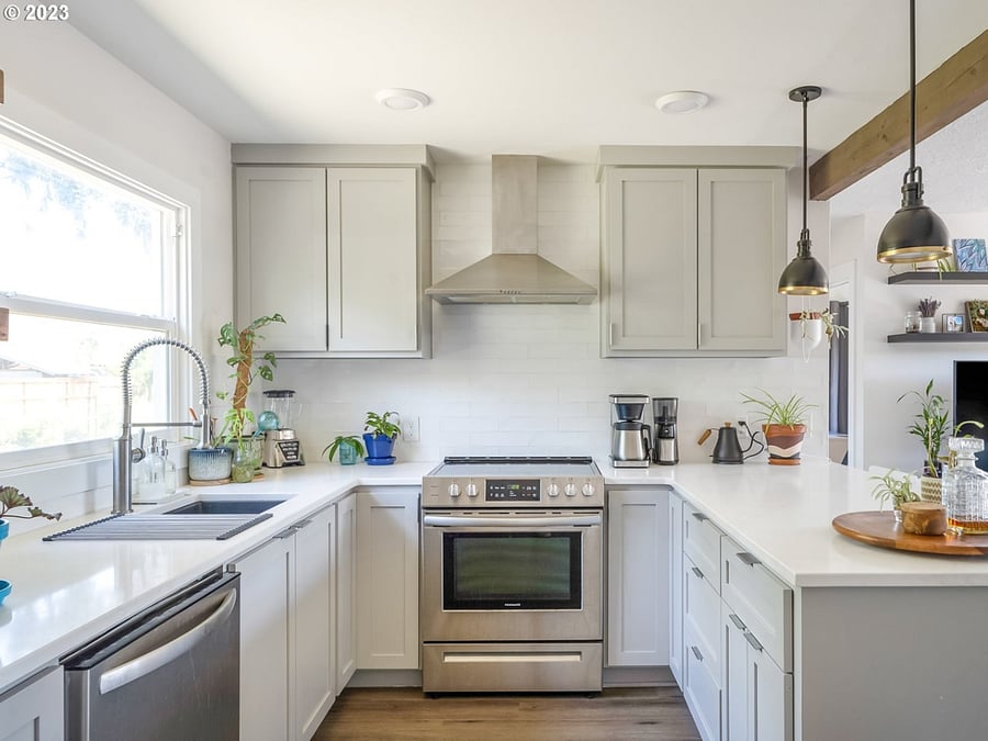 Shared kitchen and dining area, complete with espresso machine and other kitchen tools and dishes