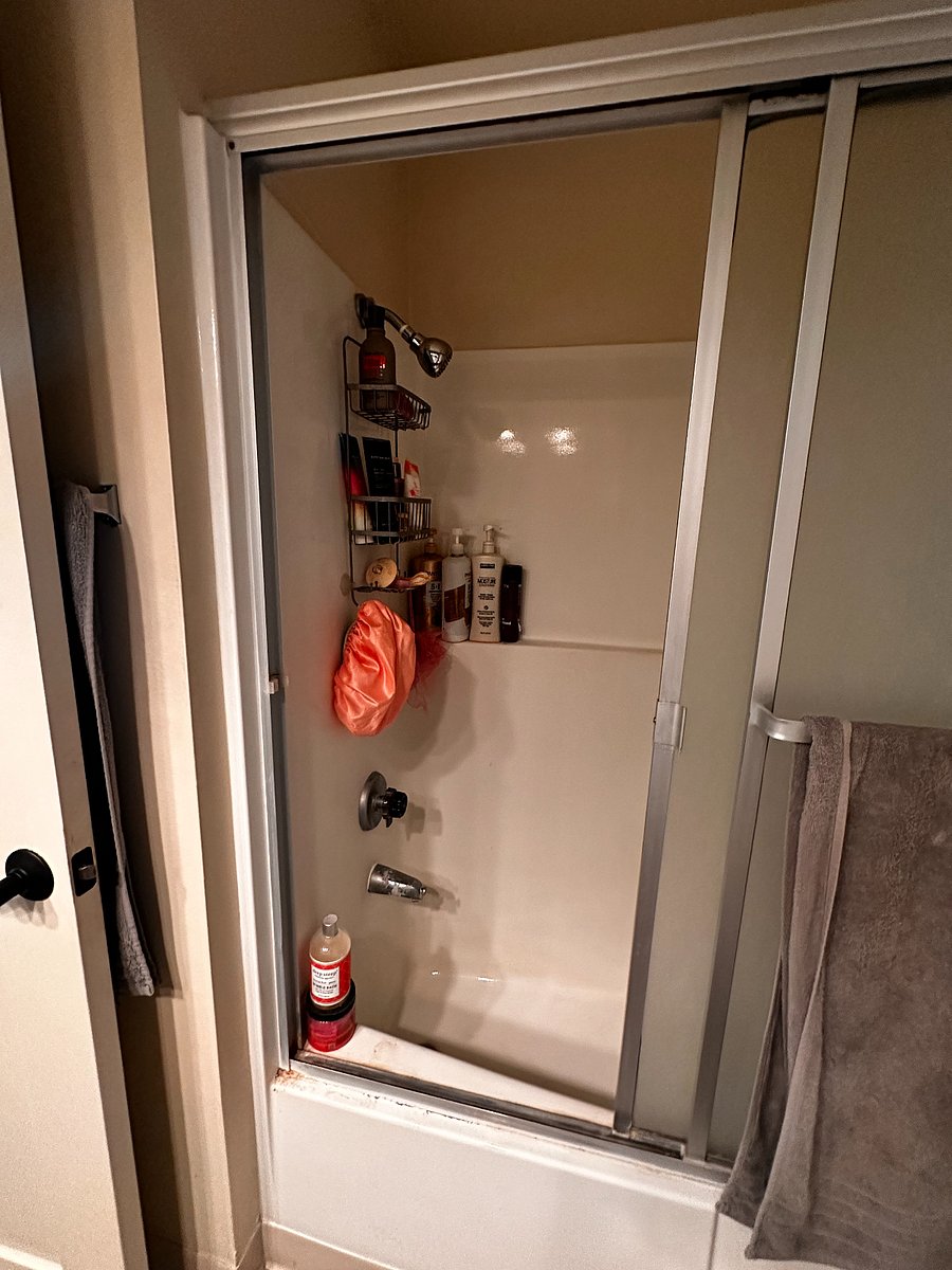Private bathroom with shower and bathtub