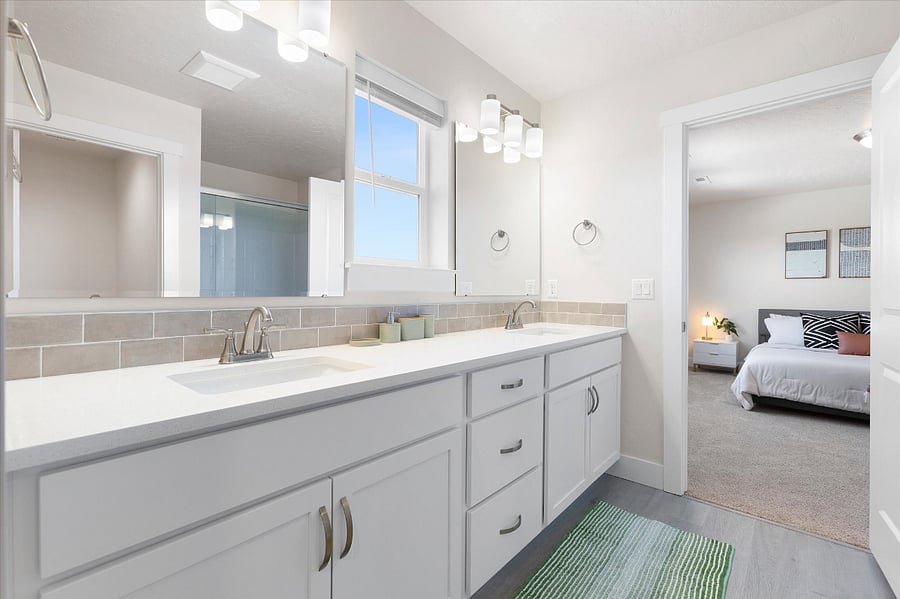 Master bathroom features double sinks, shower and large walk in closet.